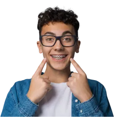 Patient smiling with traditional metal braces