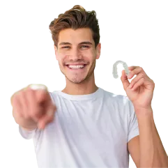 Patient holding Invisalign clear aligners